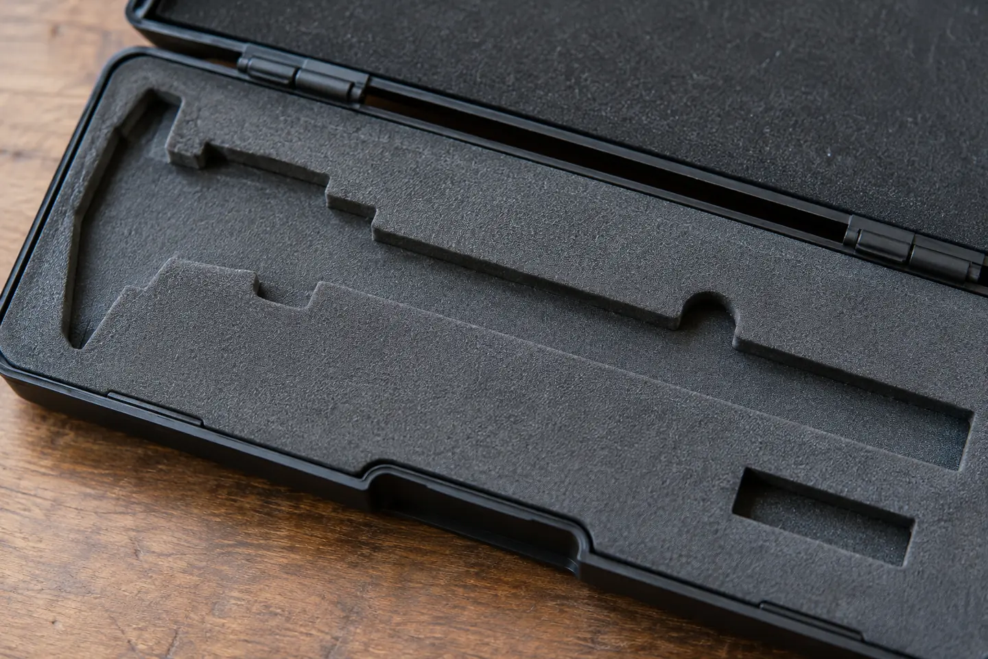 detail of a single caliper case with its empty compartment visible