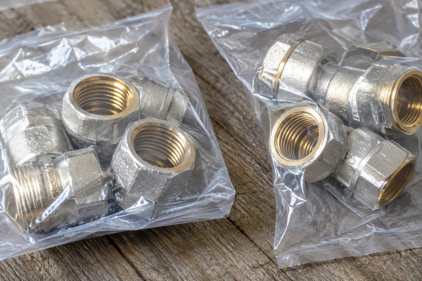 Macro view of matching metal fittings in separate supplier packaging