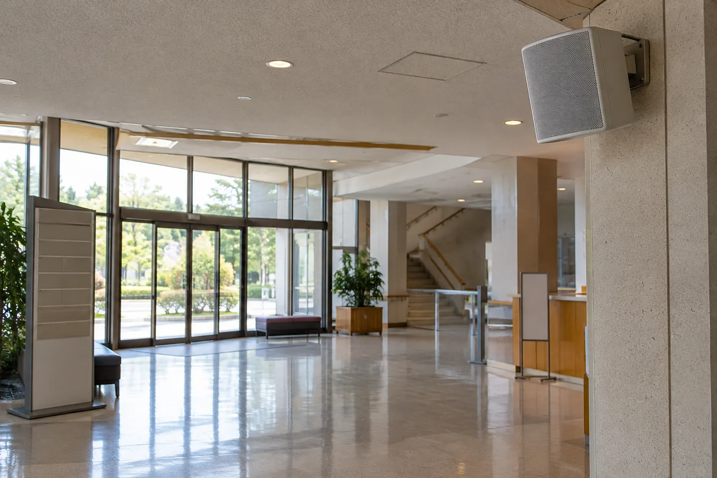 An unoccupied facility lobby with announcement equipment